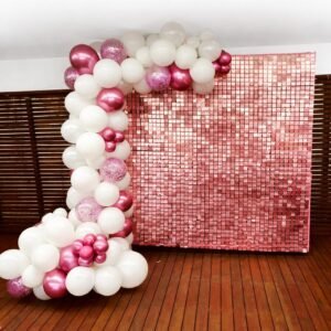 Rose gold shimmer wall backdrop with balloon garland for party hire in Sydney